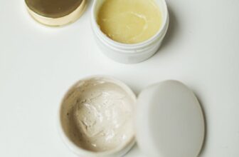 High-angle shot of skincare cream containers for self-care and beauty routines.